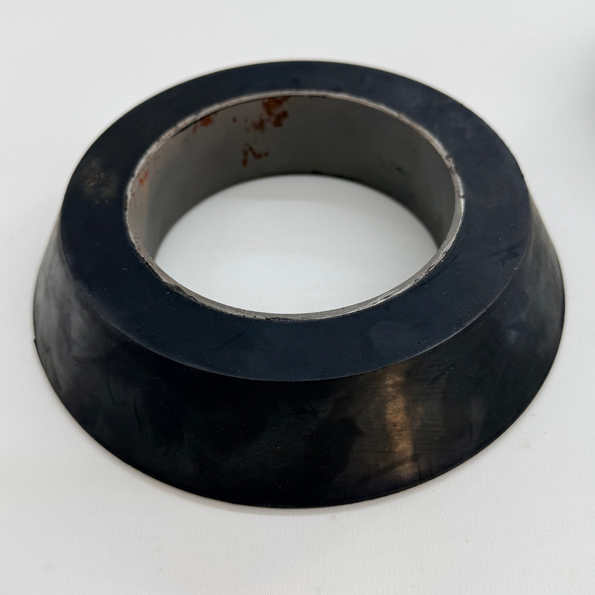 Molded rubber swab cup profile with core reinforcement