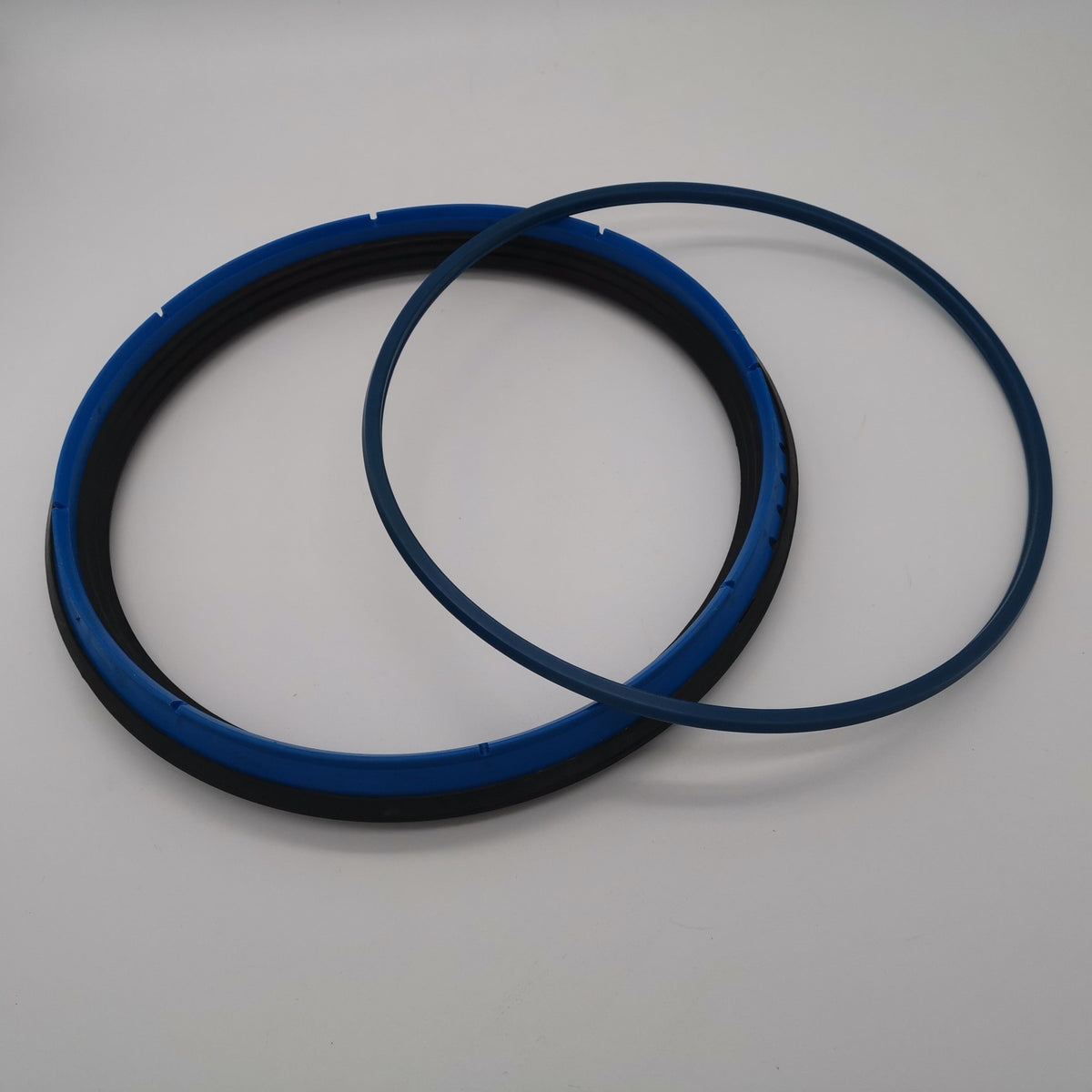 Blue and black hydraulic seal assembly shown with a separate narrow blue ring