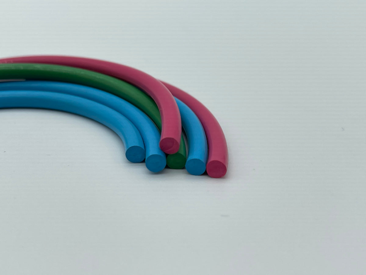 Colored custom solid elastomer rods shown in multiple diameters