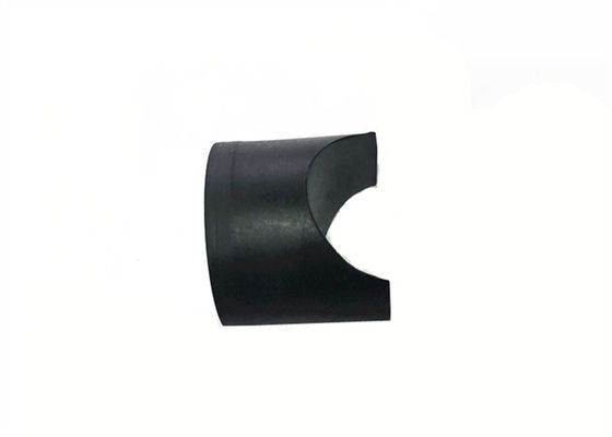 Side detail of a black molded component with a concave cutout
