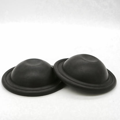 Two black 550190 pump membranes on a white background