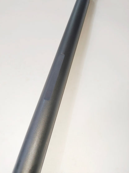 Black coated wireline flow tube with a machined flat detail.