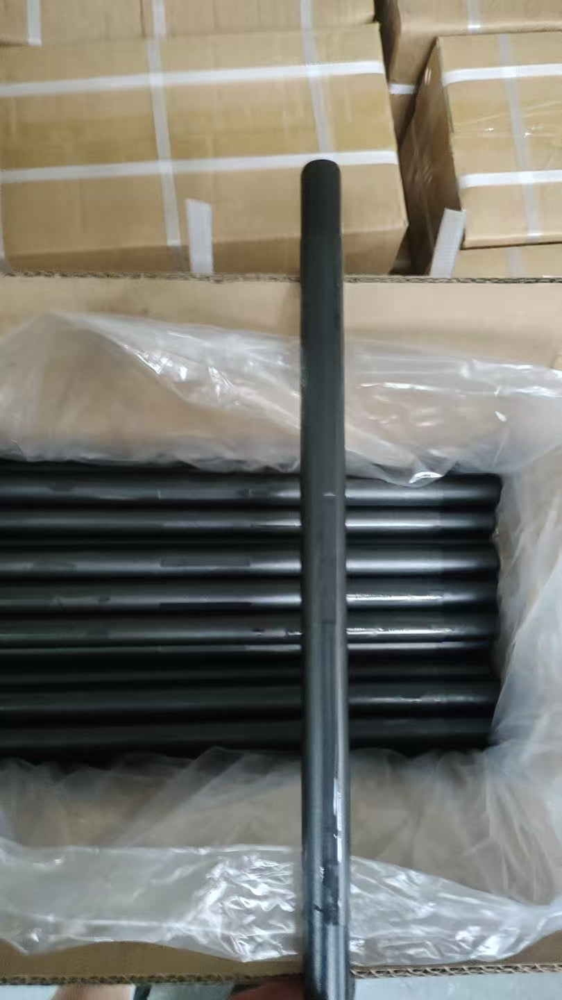 Black coated wireline flow tube shown with packed production stock.