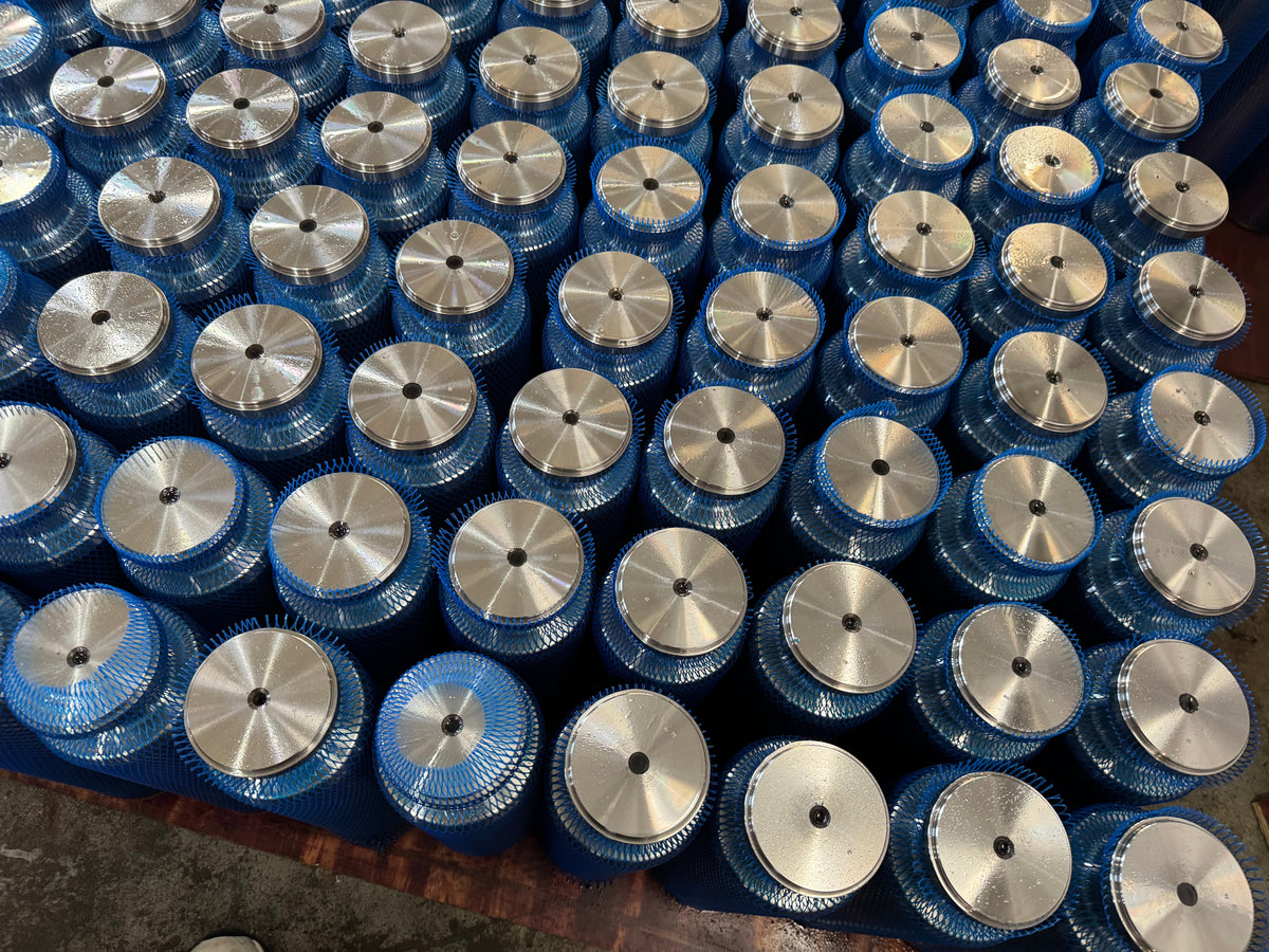 Blue-mesh-covered metal plunger bodies arranged together.