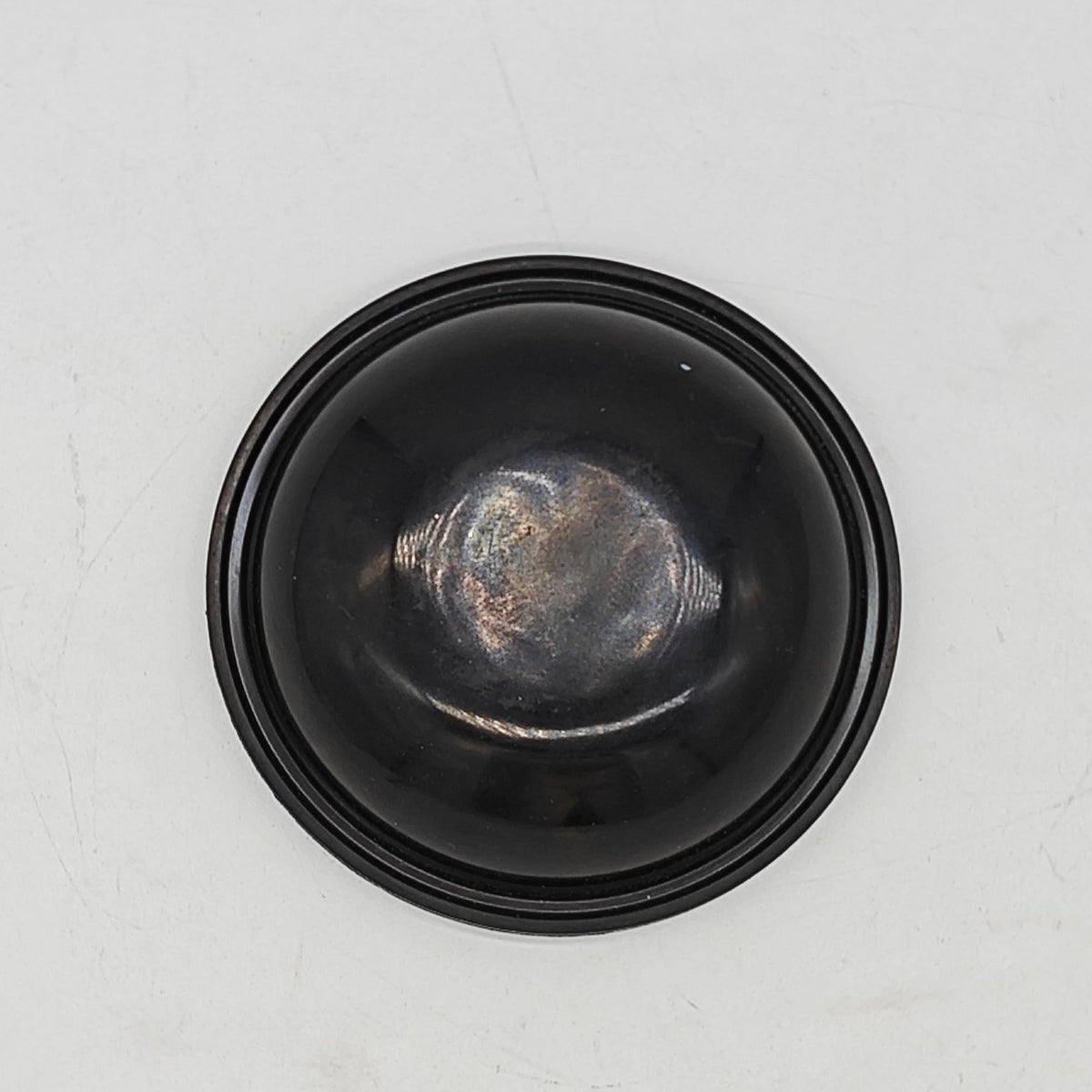 Single molded rubber diaphragm shown from the formed side