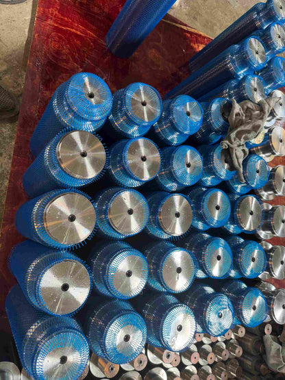 Frac pump plungers covered with blue protective mesh