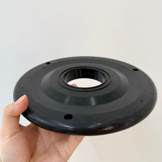 Circular black oilfield wiper element shown from the front with a formed center opening