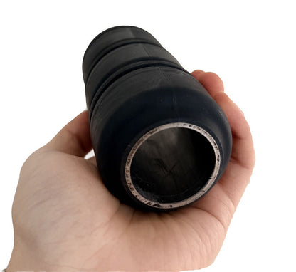 Black 2-1/2 inch RTL-type tubing swab cup held to show the metal-core opening and rounded end profile