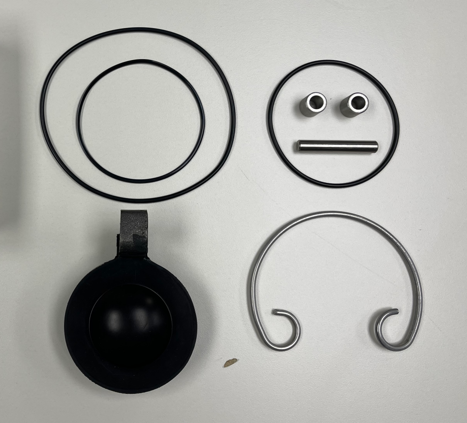 3 inch Anson-style flapper valve repair kit components arranged on a white surface