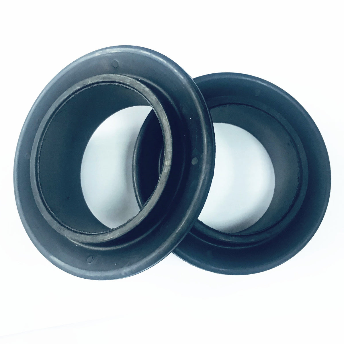 Two 5-1/2 in V-type sand-service swab cups with metal core openings