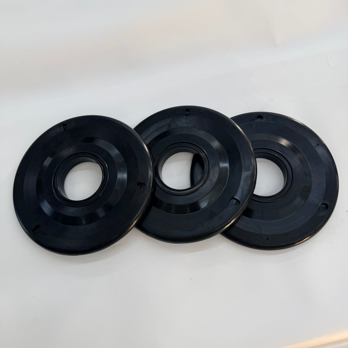 Three black 7 inch rubber pipe wipers shown from the front