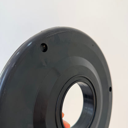 Close-up of the molded face, center opening and mounting holes on a 7 inch rubber pipe wiper