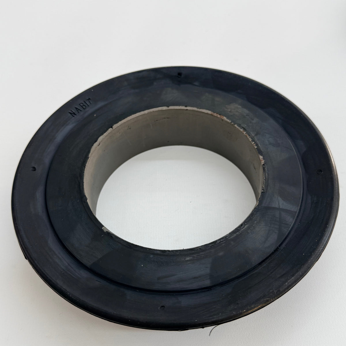Top detail of a 7 inch V-type tubing swab cup with metal core