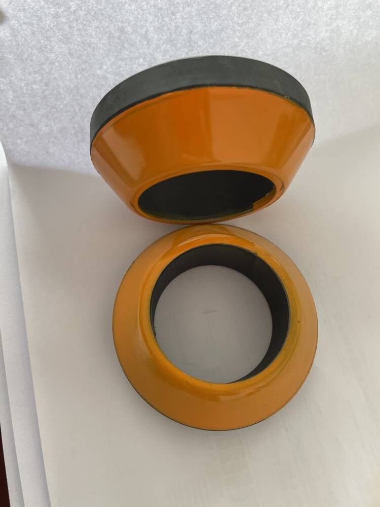 Close detail of air-operated thread protector body and protective buffer construction
