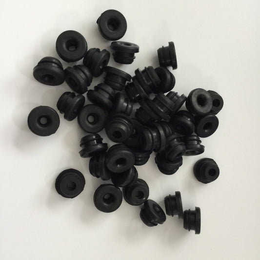 Black molded rubber panel grommets with center openings and grooved outer walls