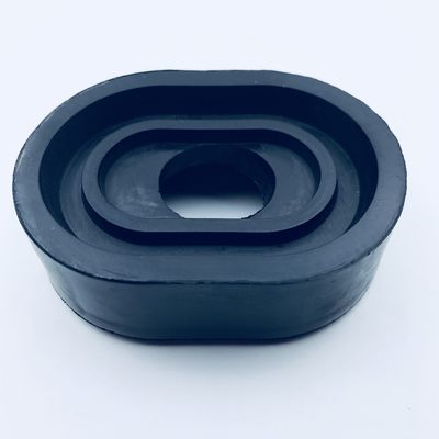 Black oval custom molded rubber part with a recessed center opening