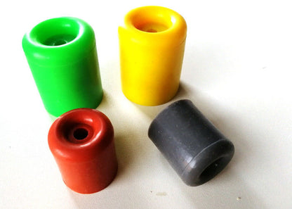 Green, yellow, red and gray cylindrical rubber leg caps and bumper tips with recessed openings