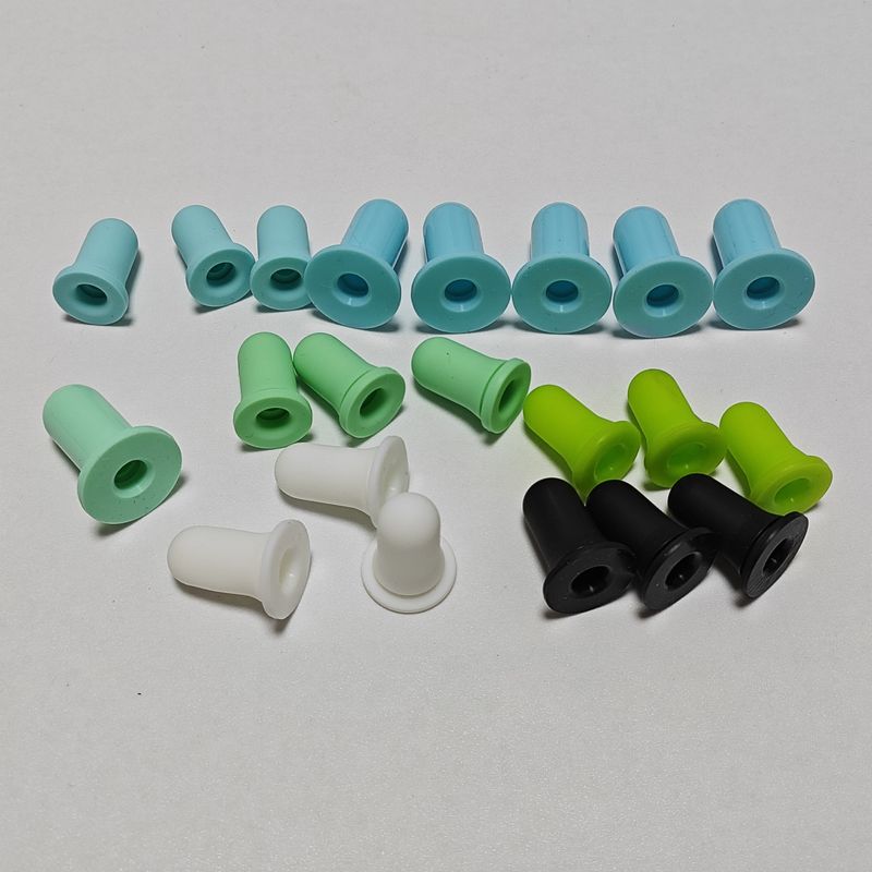 Colored molded rubber caps with closed ends and flanged openings