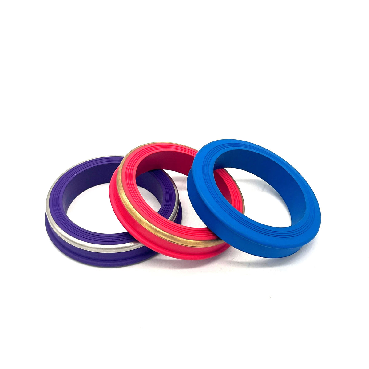Purple, red and blue hammer union seal rings with visible metal reinforcement bands