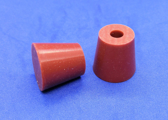 Side detail of solid and one-hole conical rubber stoppers