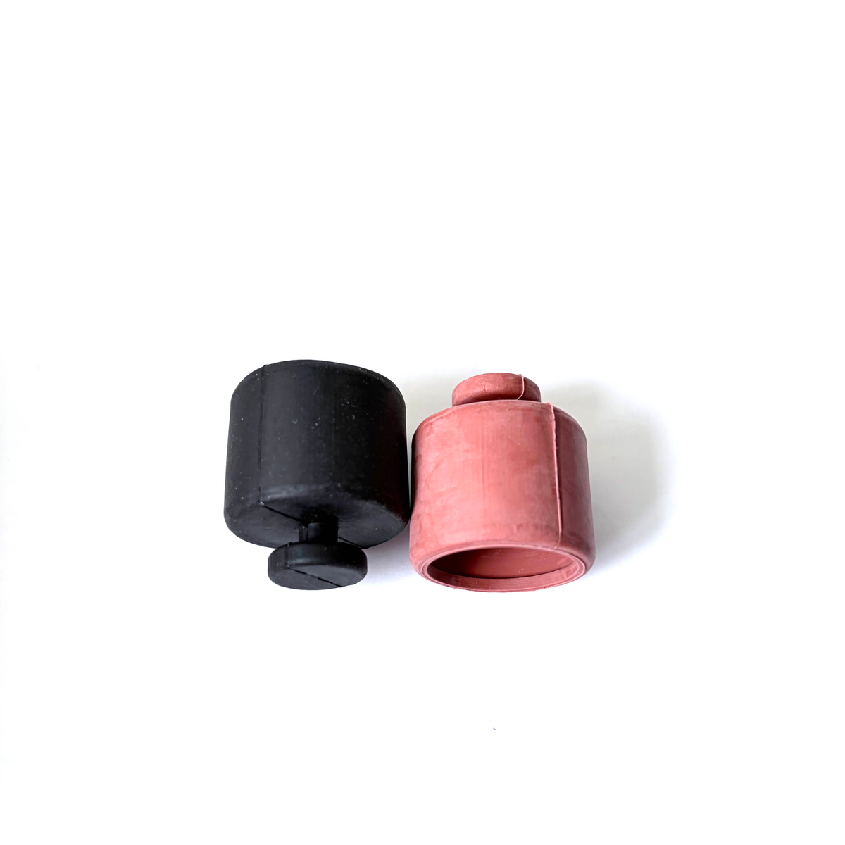 Cup-shaped molded rubber caps with closed pull features