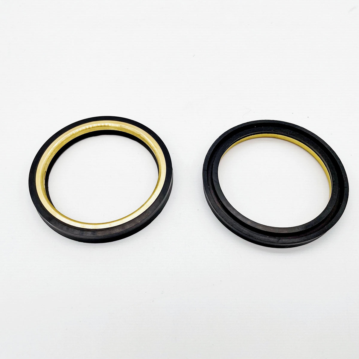 Two black circular dome valve seal rings with reinforced inner edges
