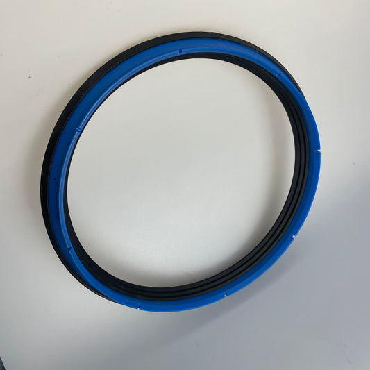 Circular hydraulic seal assembly with a blue profiled ring and black concentric elements