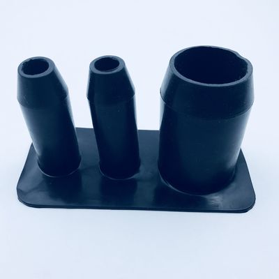 Alternate detail of a black custom molded rubber part with three openings
