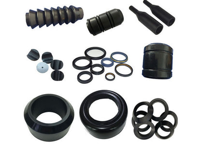Assortment of black molded rubber components for oilfield equipment