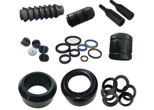 Assortment of black molded rubber components for oilfield equipment