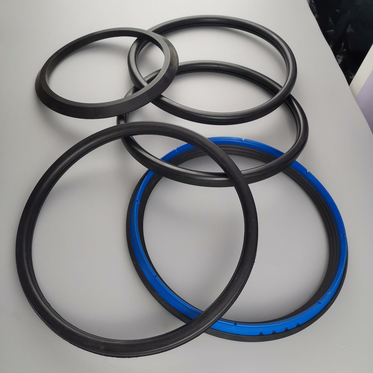 Assorted custom ring-seal profiles in black and blue