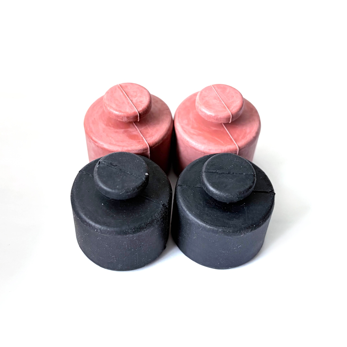 Red and black custom molded rubber protective caps with center pull tabs