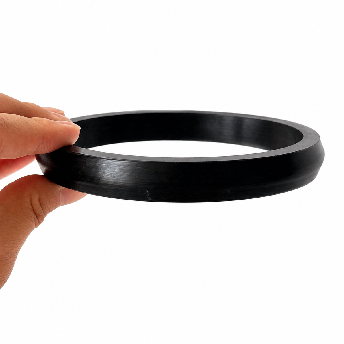 Black molded rubber ring gasket with a tapered outer profile