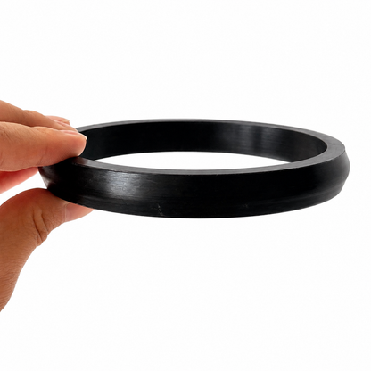 Black molded rubber ring gasket with a tapered outer profile