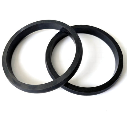 Pair of black custom molded rubber ring seals shown from above