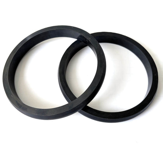 Pair of black custom molded rubber ring seals shown from above