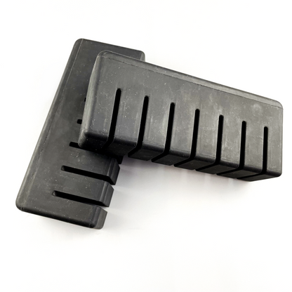 Rectangular molded rubber bumper blocks with transverse relief slots