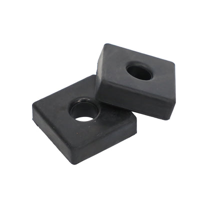 Two black rectangular rubber mounting feet with center holes