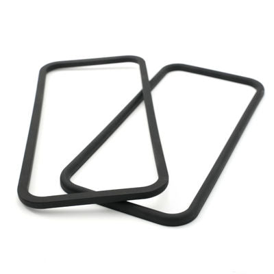 Three black molded rectangular rubber seals with rounded corners shown in overlapping positions