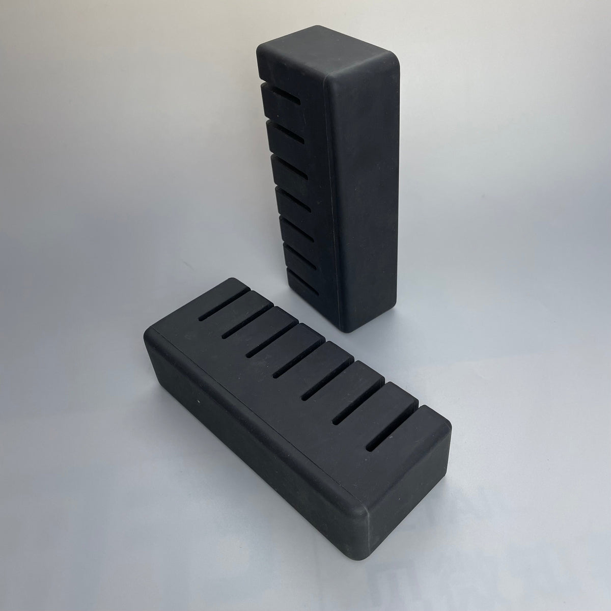 Black molded rubber block with parallel slots - custom stop or insert
