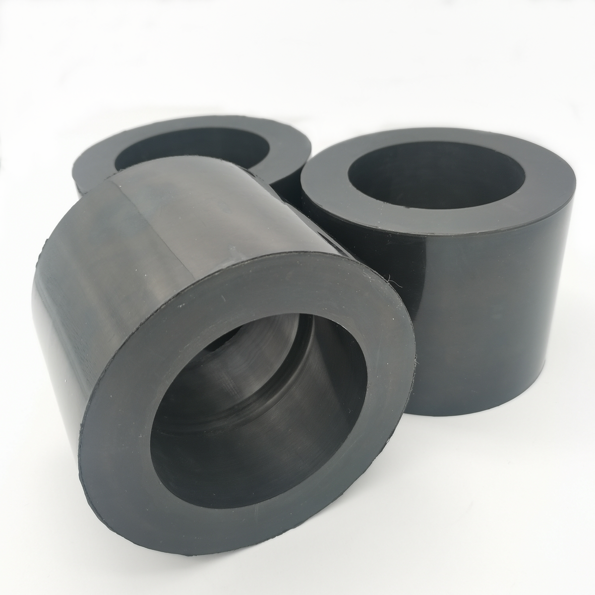 Molded rubber bushing and sleeve set with center bores