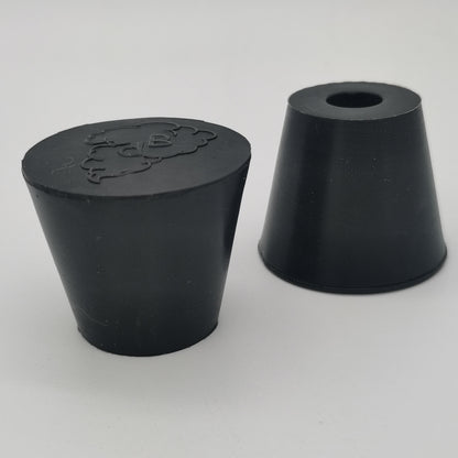 Molded rubber stopper with solid and one-hole configurations