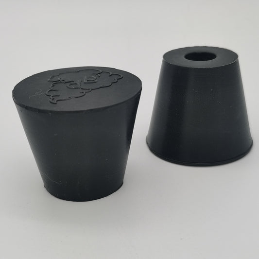 Molded rubber stopper with solid and one-hole configurations
