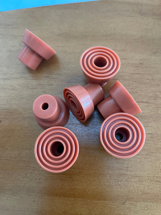 Rubber feet with center mounting holes and concentric ribs