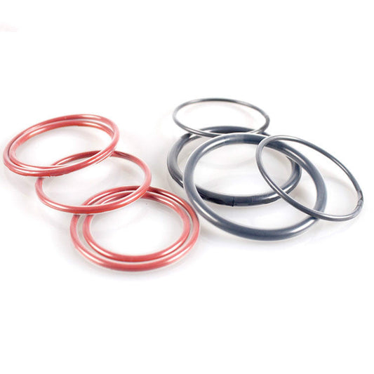 Red and black encapsulated O-rings with visible translucent outer jackets