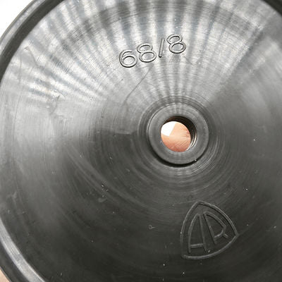 Fabric-reinforced molded rubber pump diaphragm with a center opening