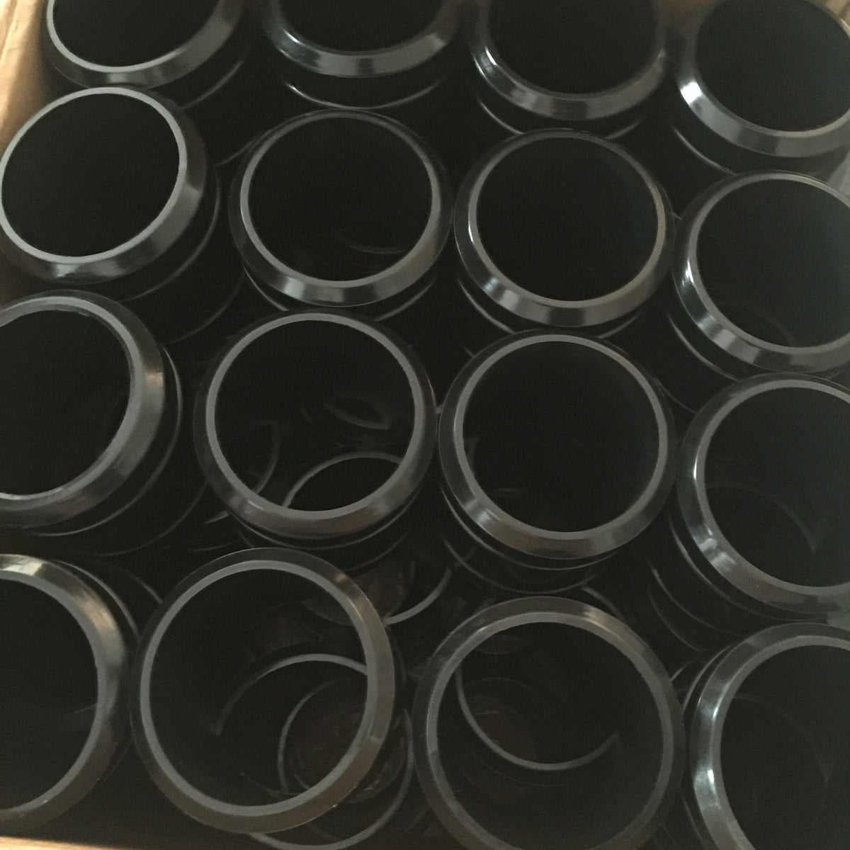 Black annular components packed together, detailed from above