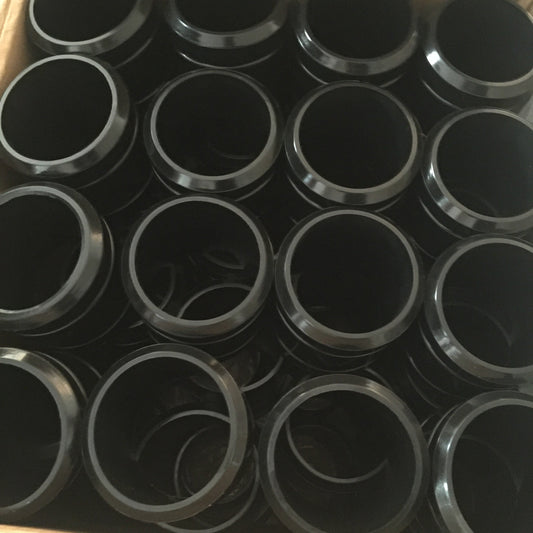 Black annular components packed together, viewed from above