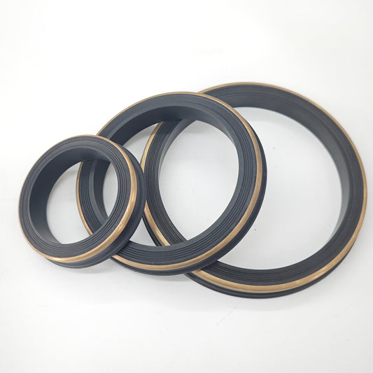 Representative hammer union seal rings with metallic backup bands