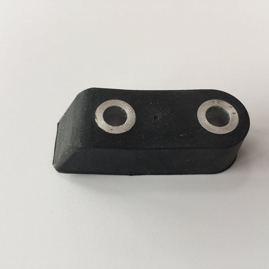 Black molded rubber component with two embedded metal sleeves